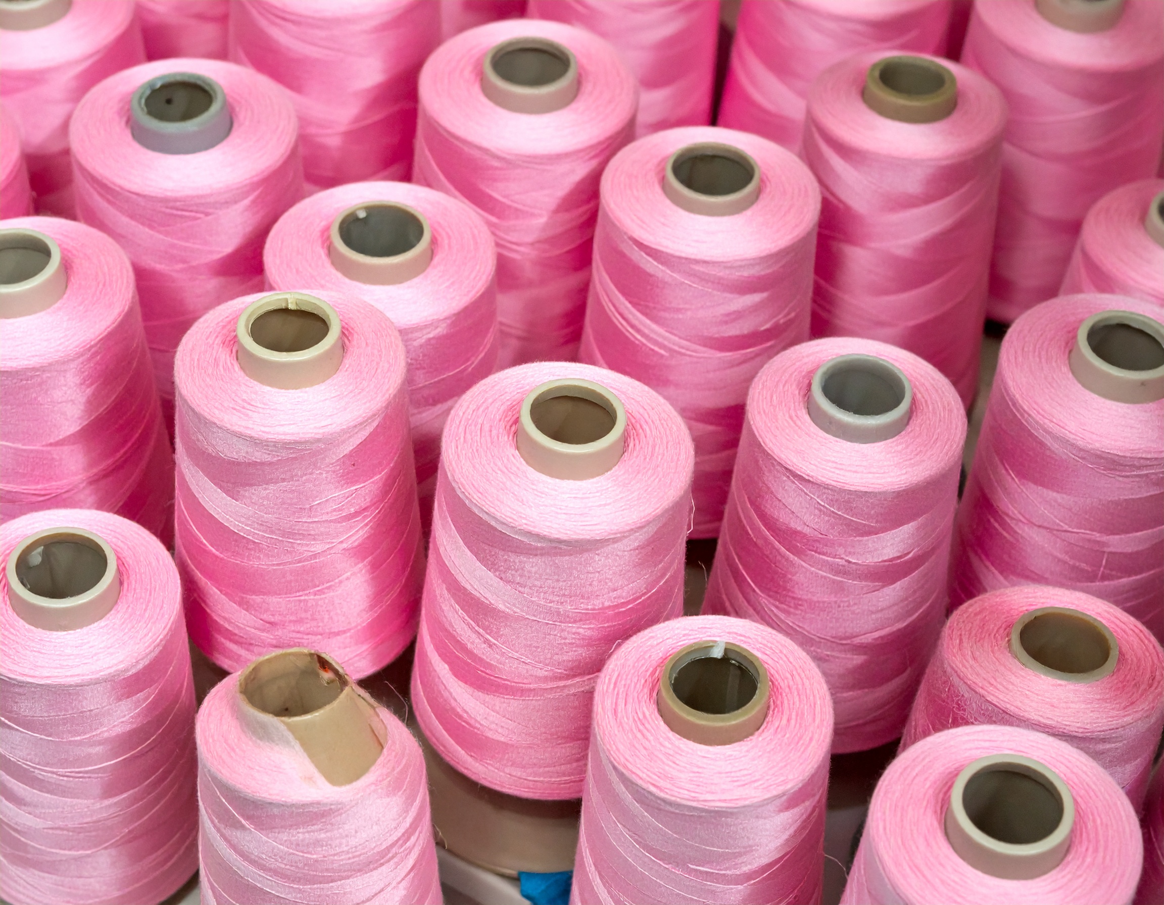 spools of pink thread